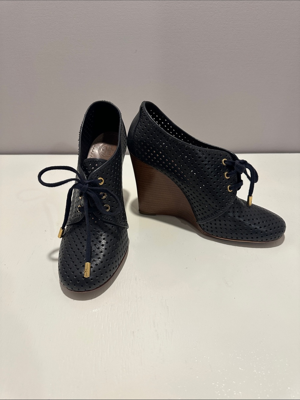 Tory Burch Navy Perforated Lace-Up Wedge Booties with Gold Accents